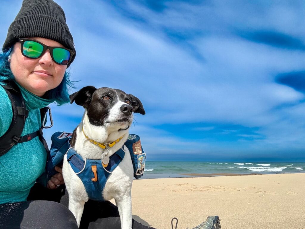 woman and dog on beach